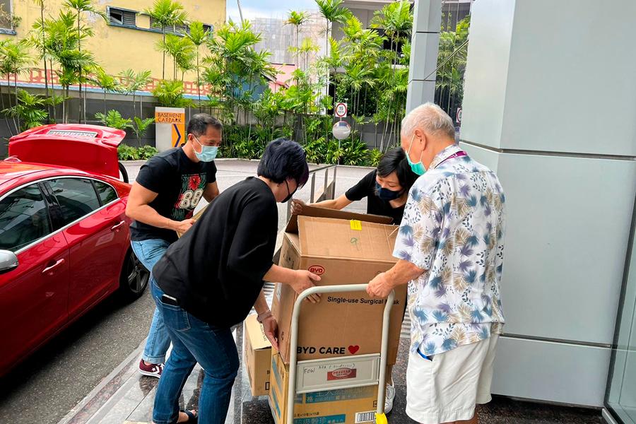 Our Singapore team delivering essential items to Dementia Singapore’s
                centre in Bendemeer